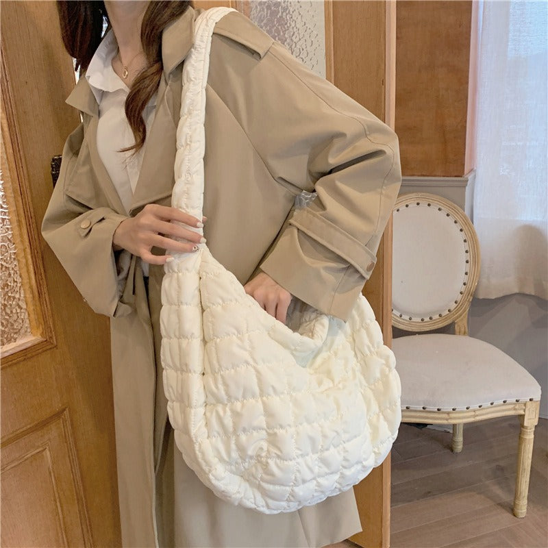 Versatile women's down shoulder bag, perfect lightweight travel companion & stylish everyday accessory.