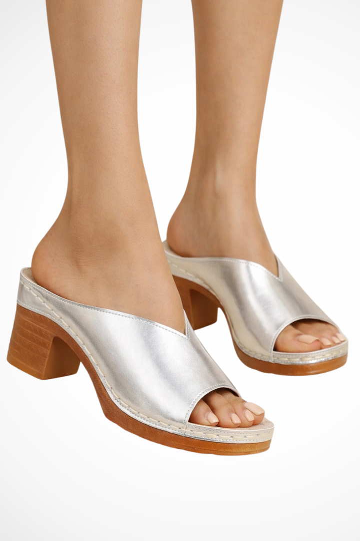Stylish women's open-toe mules with comfortable block heels, easy slip-on footwear.