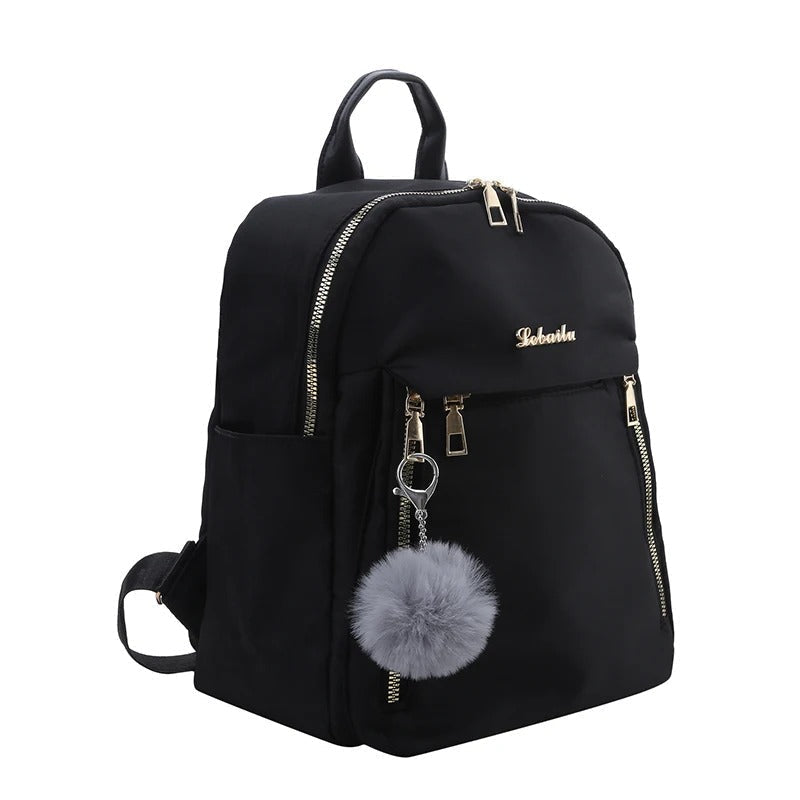 Fashionable black PU leather daypack for women, ideal for travel and daily essentials.