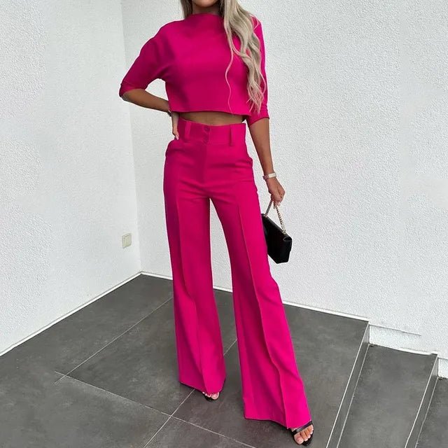 Elegant women's two-piece casual chic set with a rib-knit crop top and flowing wide-leg pants.