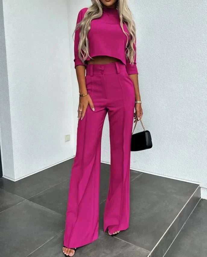 Full shot of women wearing a comfortable rib-knit cropped top and wide-leg pants loungewear set.