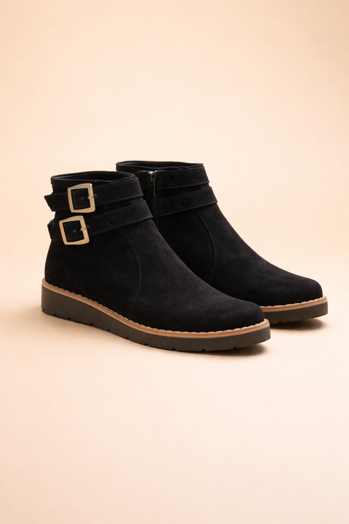 Women's chic structured black ankle boots with textured sole, perfect for versatile fall & winter style.
