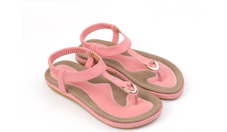 Cushioned women's T-strap sandals with elastic back for superior comfort and a secure fit, ideal for flats.