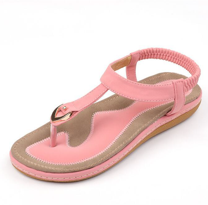 Women's comfortable T-strap sandals with a cushioned footbed and elastic back, essential chic summer footwear.