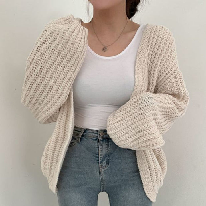 Versatile women's chunky knit cardigan. Features balloon sleeves & relaxed open front for easy layering.