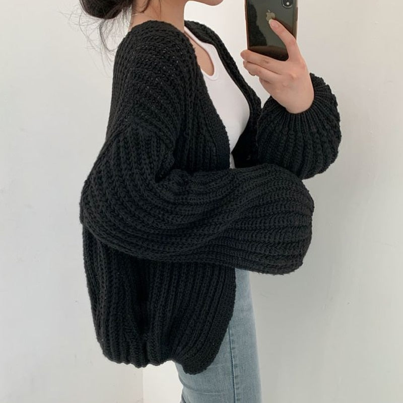 Stylish women's chunky knit cardigan. Relaxed fit, balloon sleeves, an essential cozy layer for fall fashion.