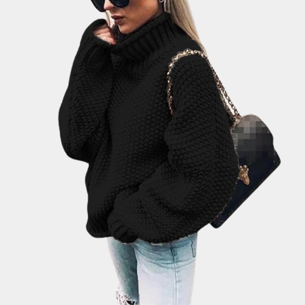 Modern women's chunky sweater featuring a high neck and relaxed fit, great for spring fashion.