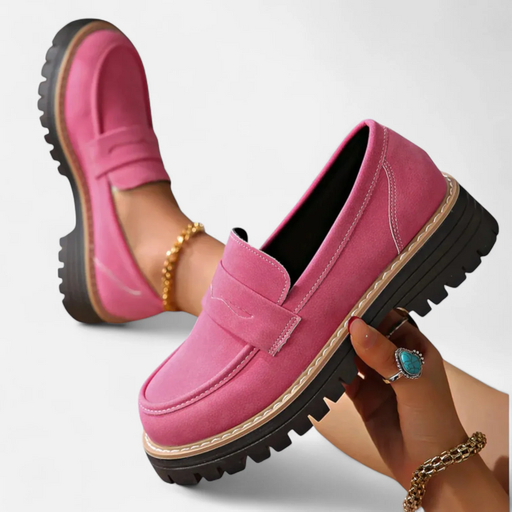 Close-up of women's chunky sole loafers, showing classic stitching and durable slip-on construction.