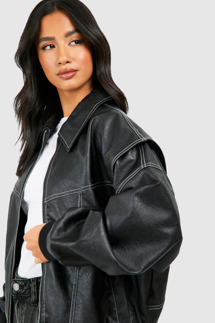 Close shot of the texture of a premium faux leather bomber jacket for women