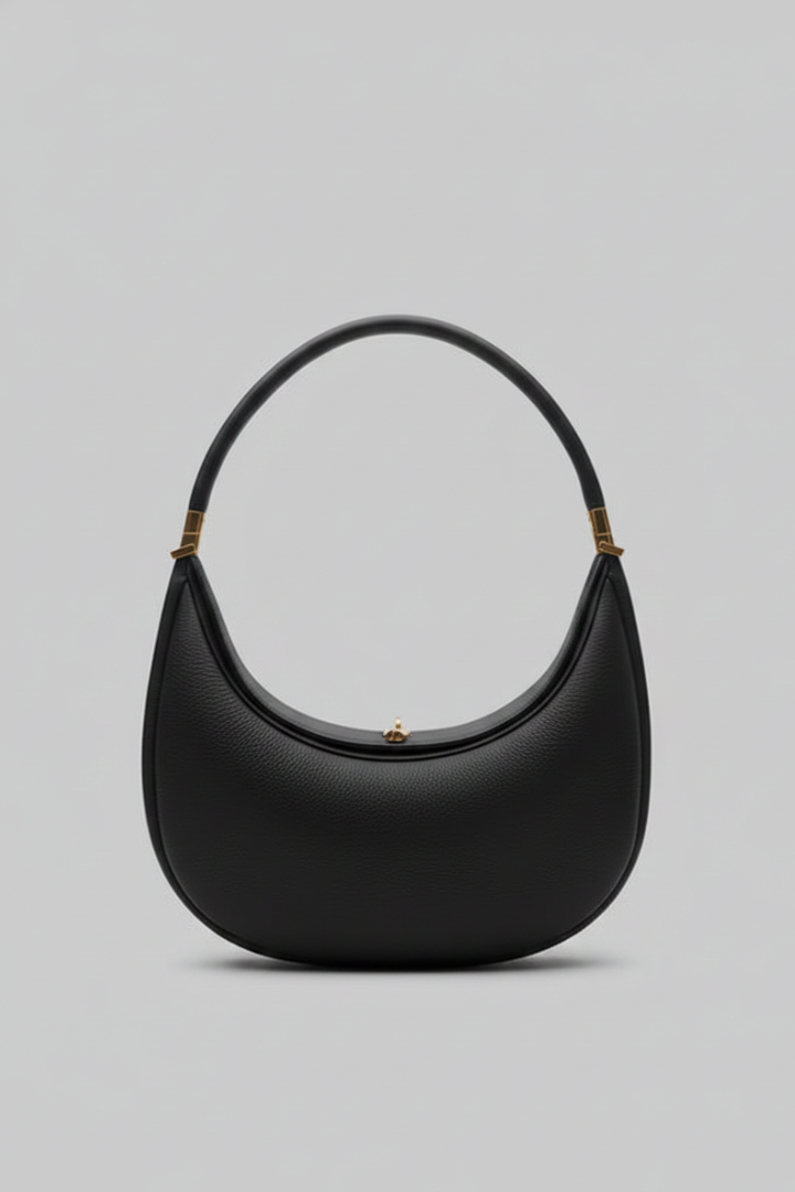 Women's classic black half-curve shoulder bag with gold-tone hardware, perfect for everyday use