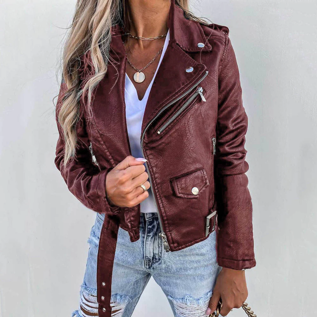 Trendy women's outerwear: a black leather moto jacket with an eye-catching zipper, enhancing any outfit.
