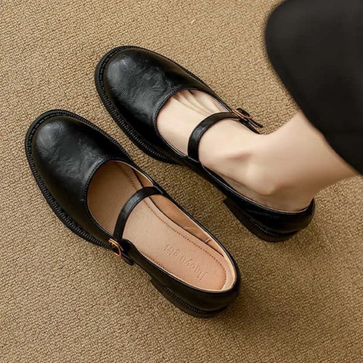 Women's classic black leather Mary Jane flats with buckle strap and comfortable block heel