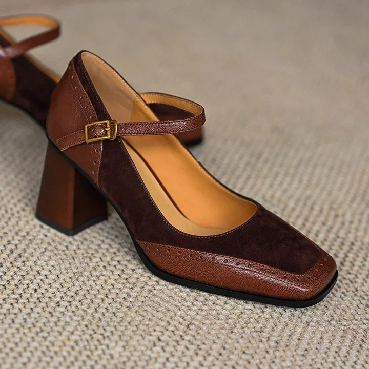 Women's formal leather shoes with a comfortable low heel, ankle strap, square toe and intricate brogue.