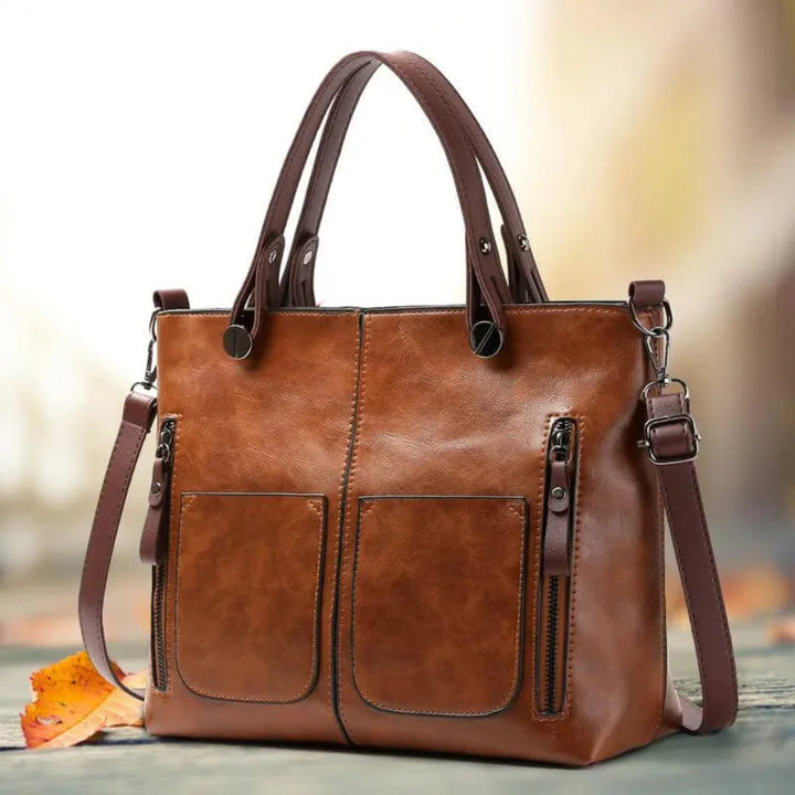 Women's classic black PU leather shoulder handbag with structured design, elegant accessory for any outfit.