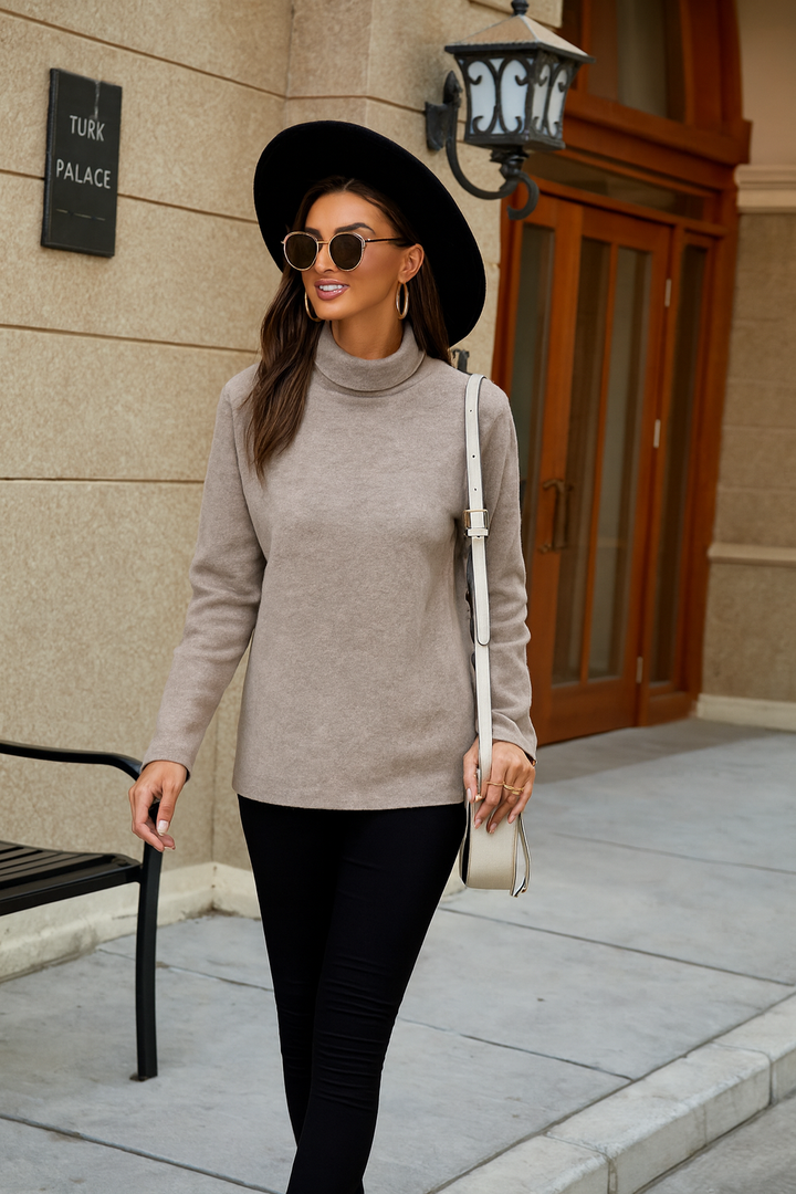 Close-up of a women's cozy knit turtleneck pullover in a casual style, great for spring fashion