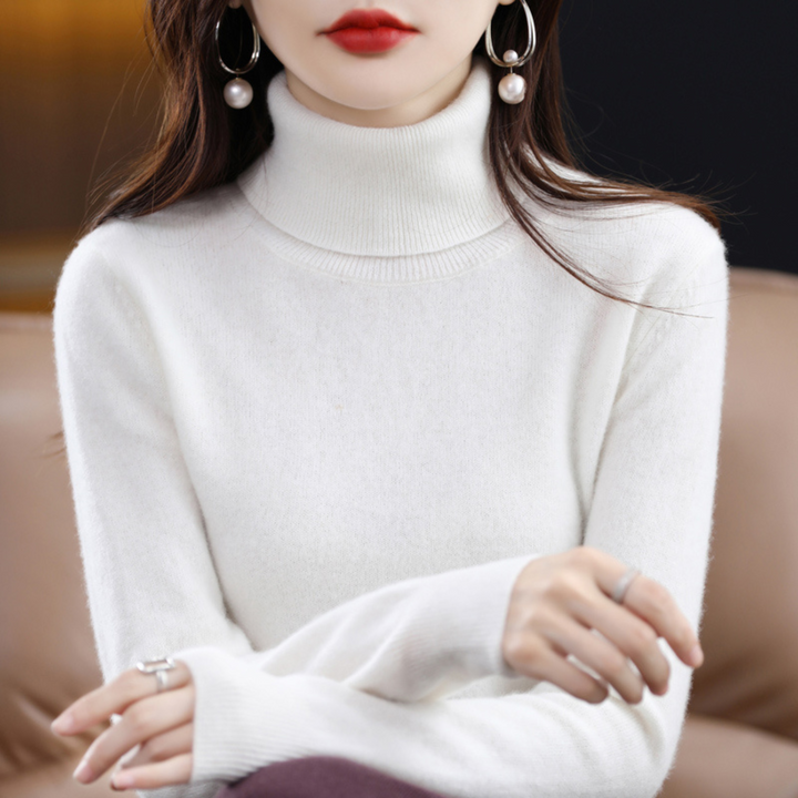 Back view of a women's elegant black knit turtleneck sweater, seamless design