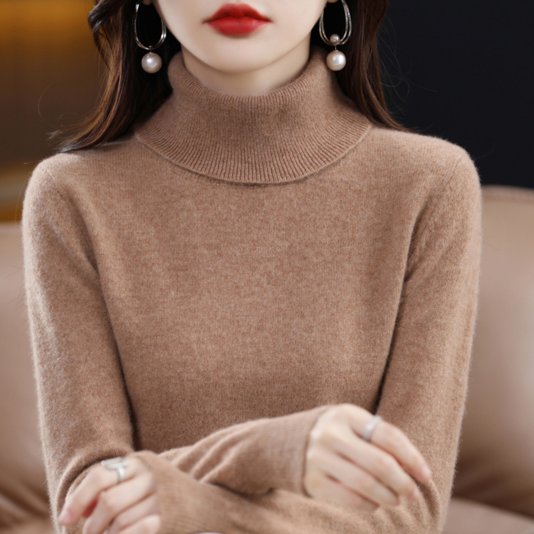 Woman smiling in a warm purple knit turtleneck sweater for seasonal comfort