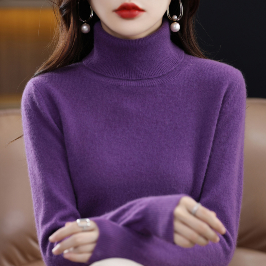 Model wearing a versatile grey women's turtleneck knit pullover sweater, front view