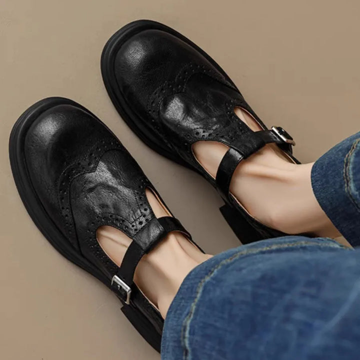 Vintage-inspired black leather T-strap flats for women, perfect for casual or semi-formal outfits
