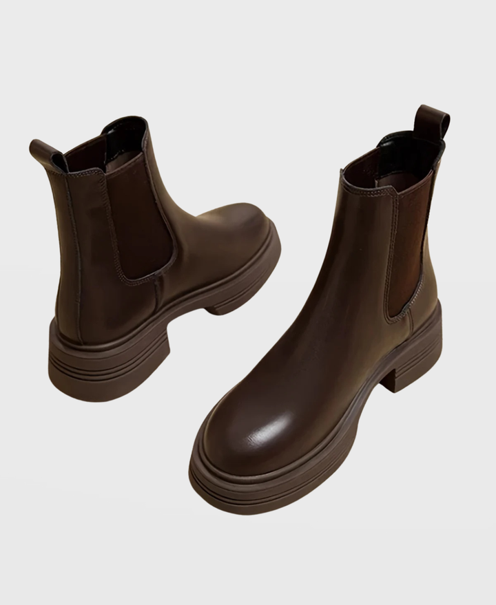 Comfortable women's slip-on Chelsea ankle boots with sturdy block heel, versatile for fall & winter fashion.