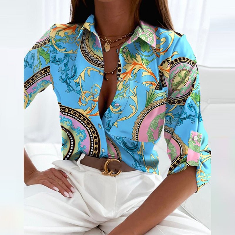 Long sleeve women's tailored blouse, highlighting cuff detail and elegant design.