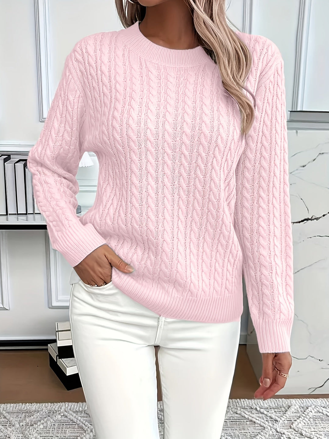 Model wearing a stylish oversized long sleeve cable knit jumper, perfect for casual winter fashion.