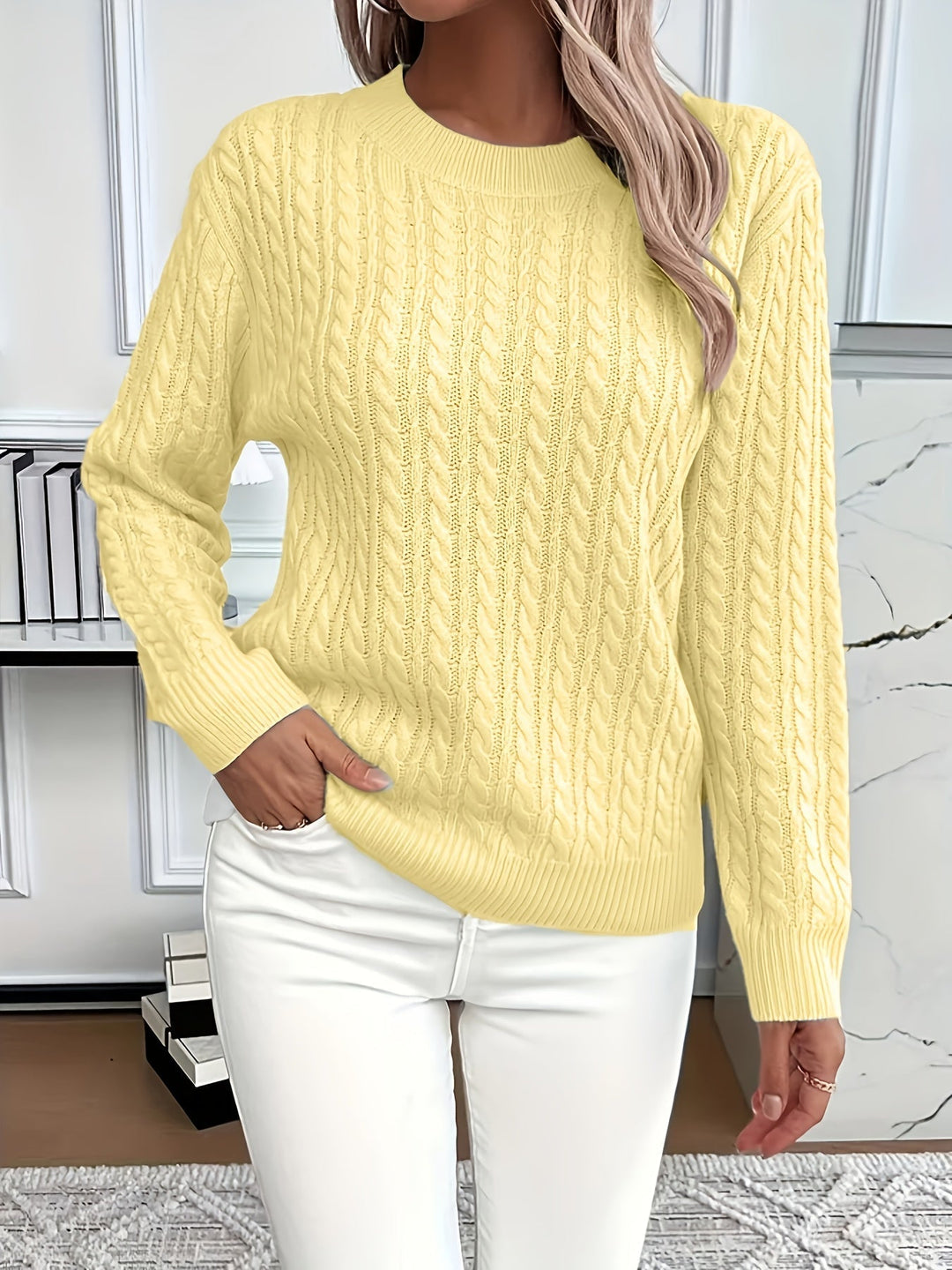 Warm cable knit jumper for women, showcasing its textured pattern and quality construction.