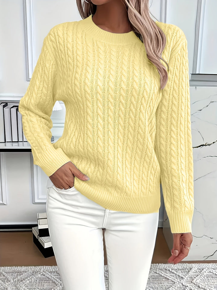 Warm cable knit jumper for women, showcasing its textured pattern and quality construction.