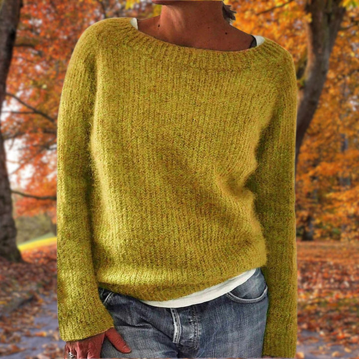 Women's classic elegant knit sweater, timeless design for winter warmth & autumn style. Cozy long-sleeve pullover.