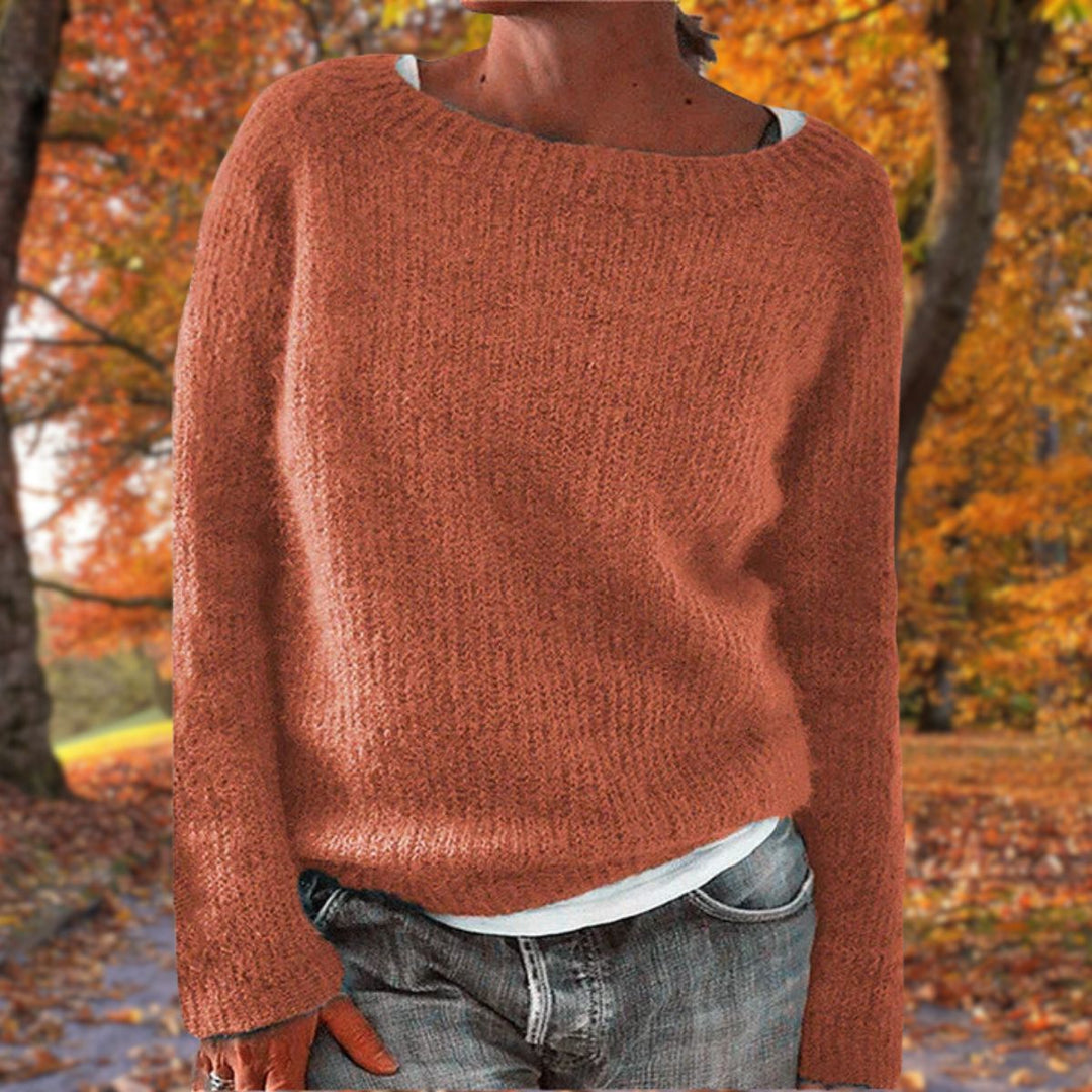 Full view of a women's classic elegant knit sweater, a warm knitwear pullover for timeless winter style.