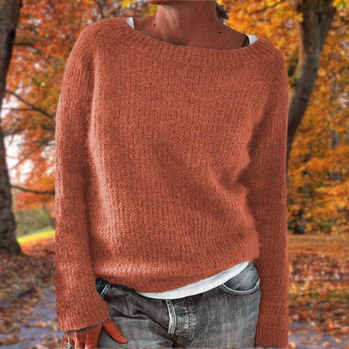 Full view of a women's classic elegant knit sweater, a warm knitwear pullover for timeless winter style.