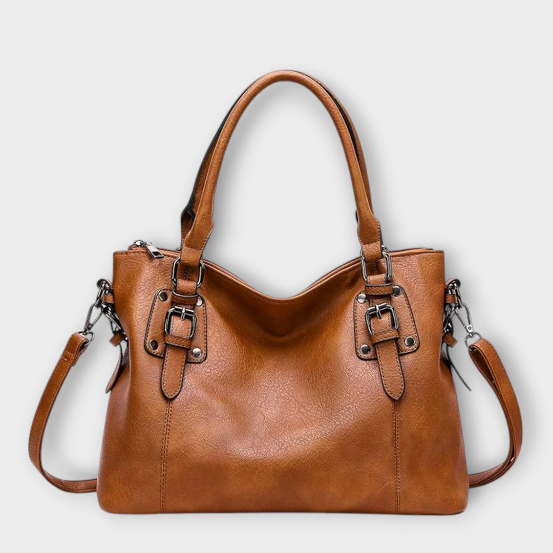 Women's classic everyday shoulder handbag in black leather with top handles and gold hardware
