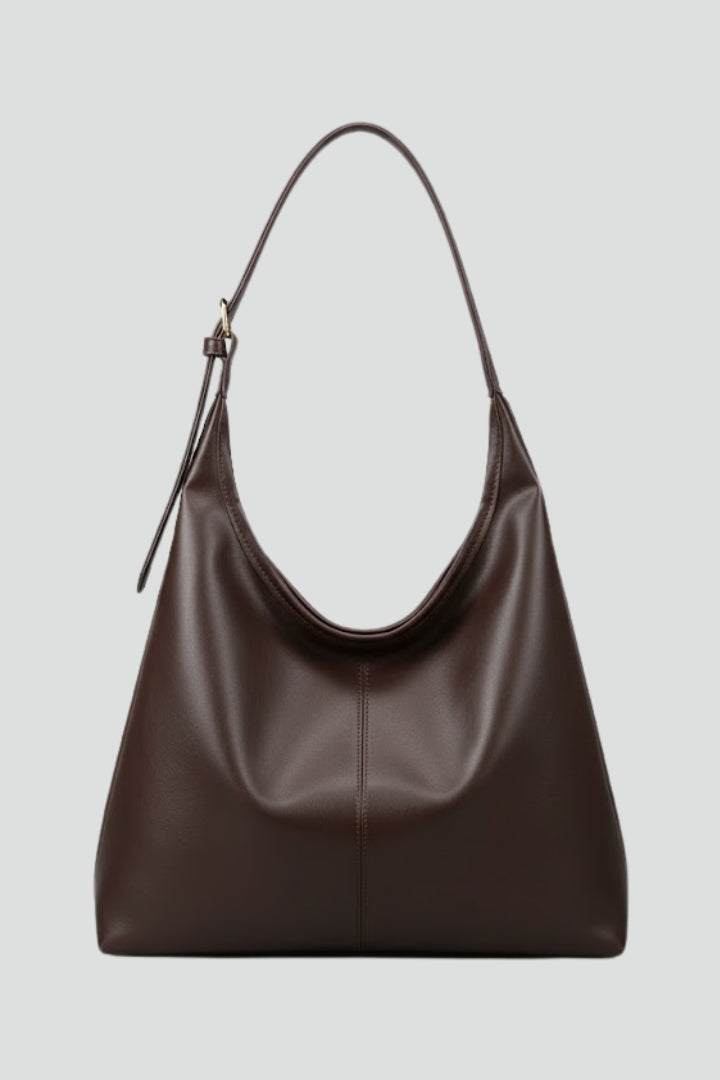 Women's classic faux leather tote bag in black, front view, shoulder strap, spacious everyday handbag.