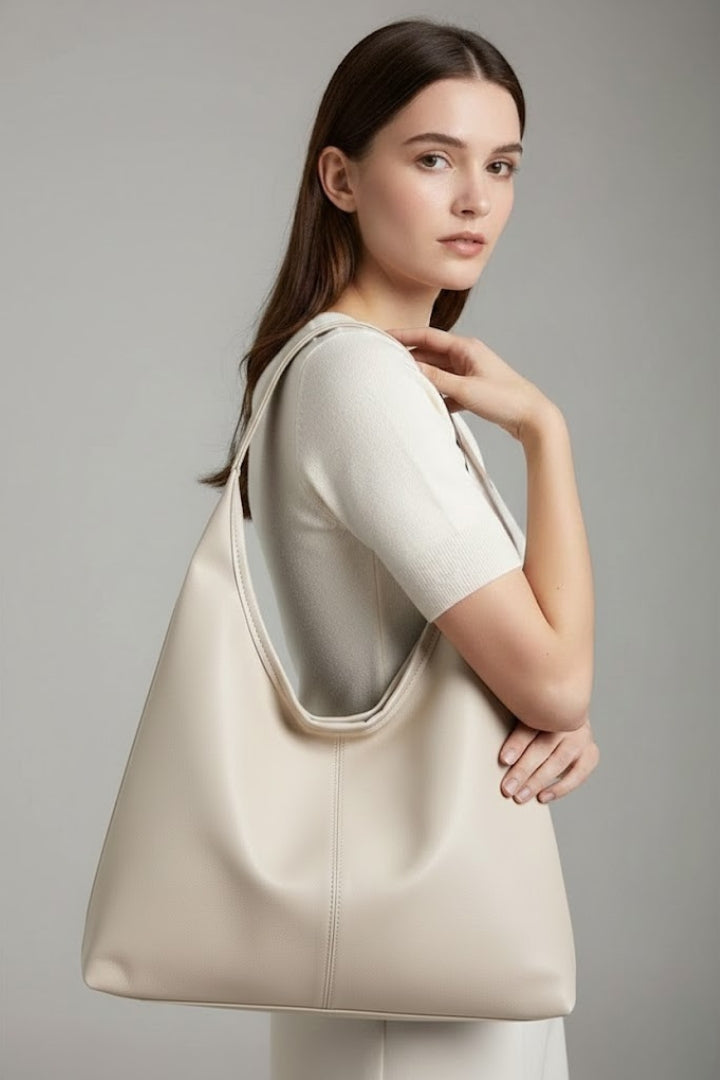 Three women's classic tote bags in black, brown, and beige faux leather, arrayed as versatile handbags.
