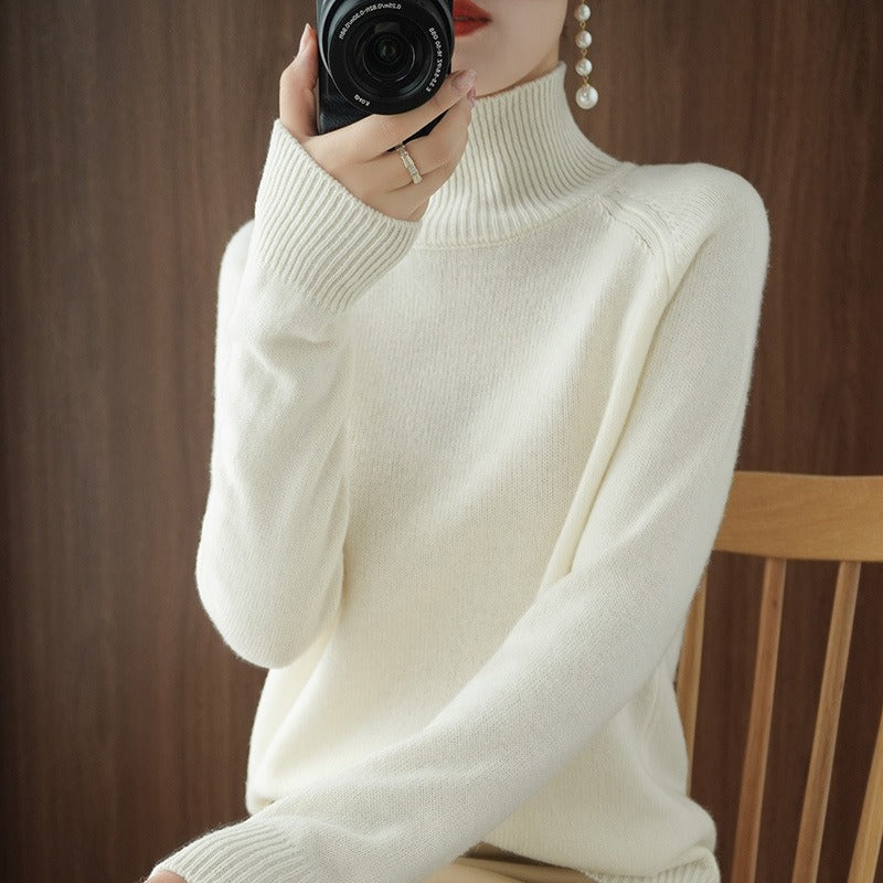 Soft knit women's turtleneck pullover, ideal for fall fashion and winter layering, offering a fitted silhouette.