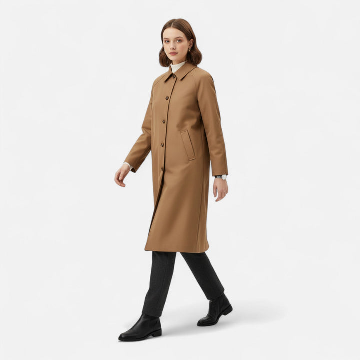 Stylish women's brown long trench coat with a classic single-breasted design. Elegant for autumn fashion.