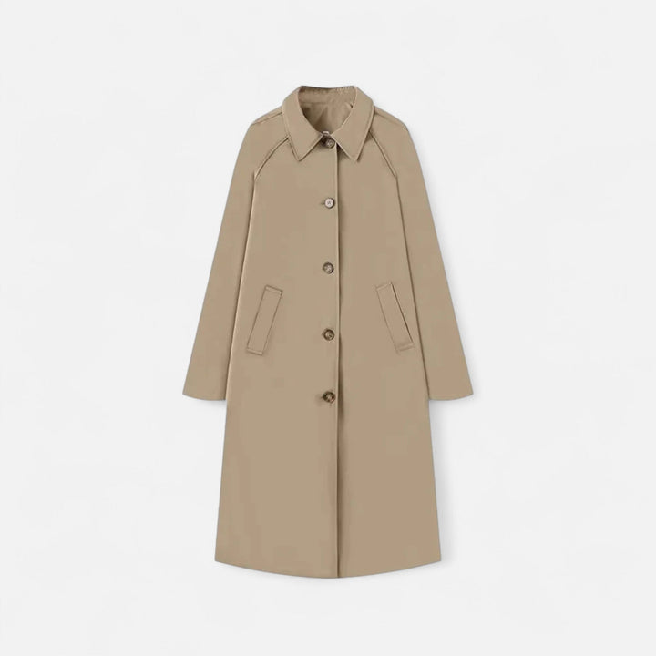 Loose fit single-breasted women's long trench coat in a classic retro style. Effortless everyday elegance.