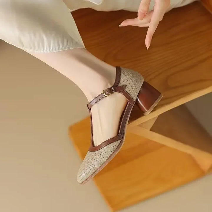 Elegant women's perforated mid-heel shoes, perfect for dressy occasions