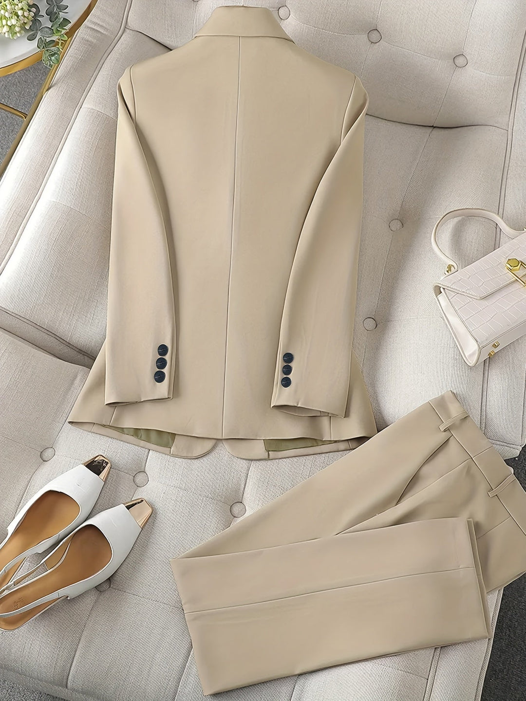 Elegant women's professional wear: black notched lapel blazer and straight-leg pants
