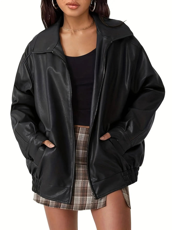 Classic black oversized bomber jacket for women, a comfortable and stylish outerwear piece