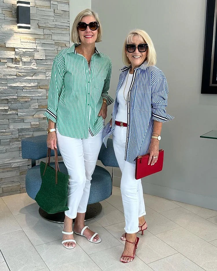 Model wearing a relaxed fit women's pink striped button-up shirt, styled for everyday summer fashion