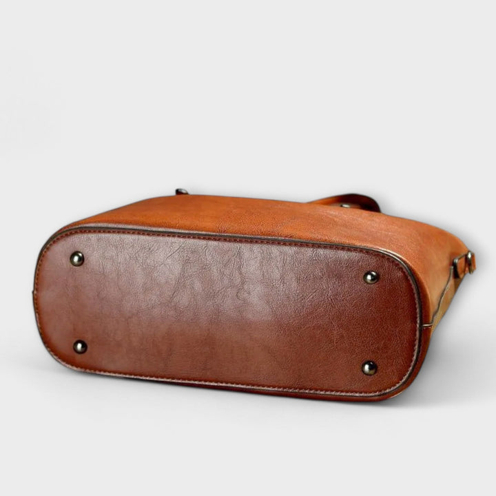 Brown leather women's shoulder bag with gold hardware