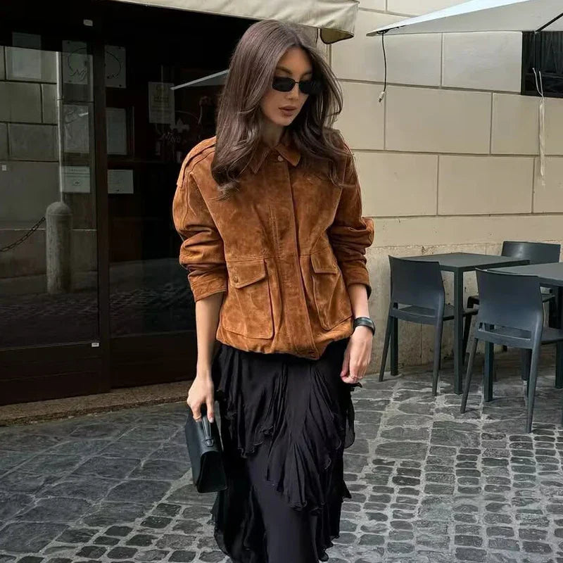 Close-up of women's casual jacket, streetwear style, featuring prominent front pockets and durable fabric.