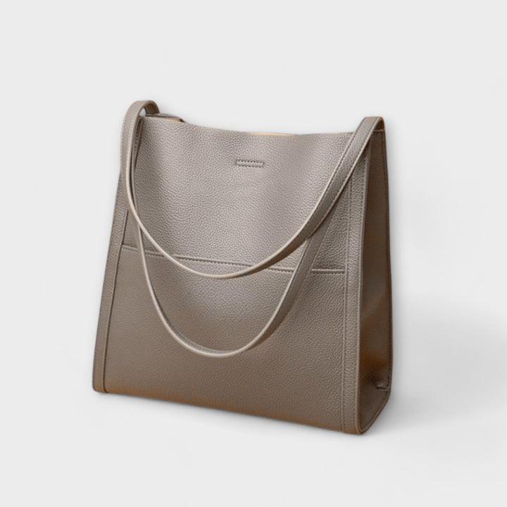 Close-up of the elegant clasp on a women's structured shoulder handbag for a sophisticated look.