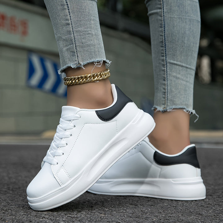 Stylish white leather fashion sneakers for women, perfect for everyday wear and versatile outfits