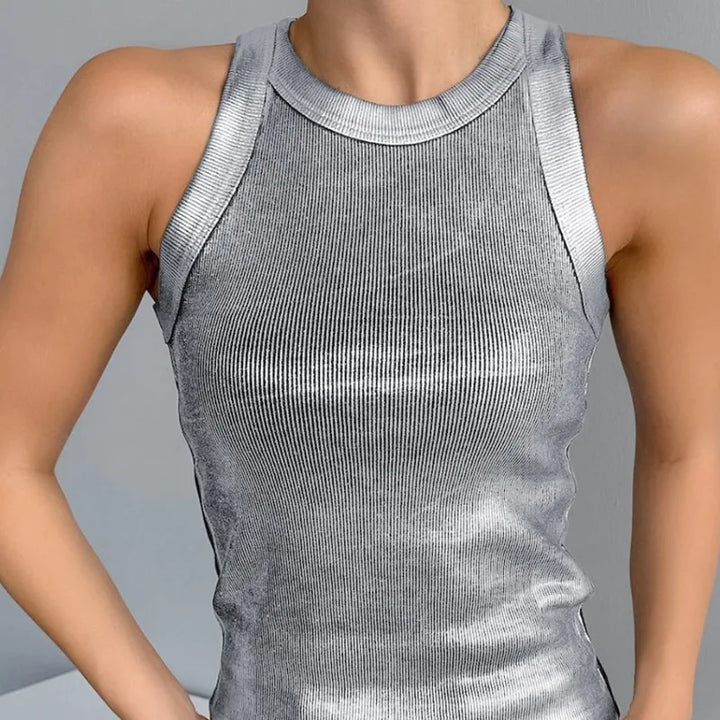 Female model wearing a pink polyester tank top, basic casual wear, side view