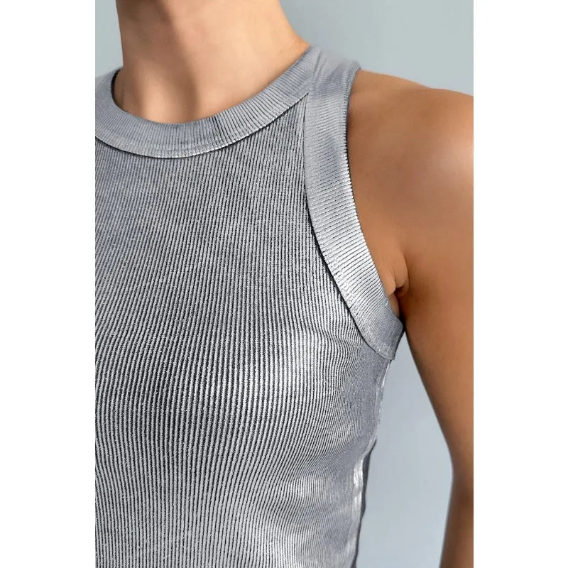 Detail of polyester fabric texture on a women's classic tank top, sleeveless design