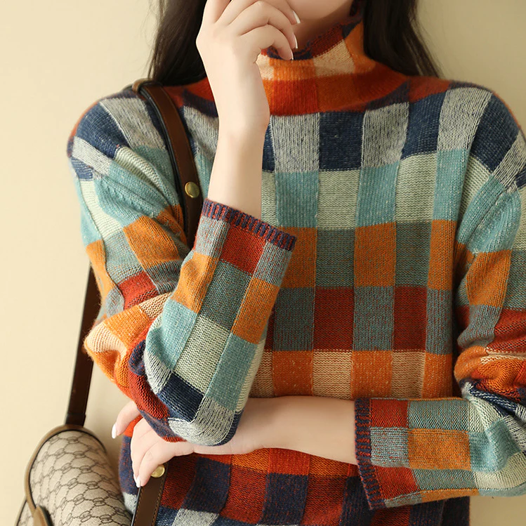 Casual women's knitted sweater featuring a unique color block and check pattern, ideal for relaxed fit.