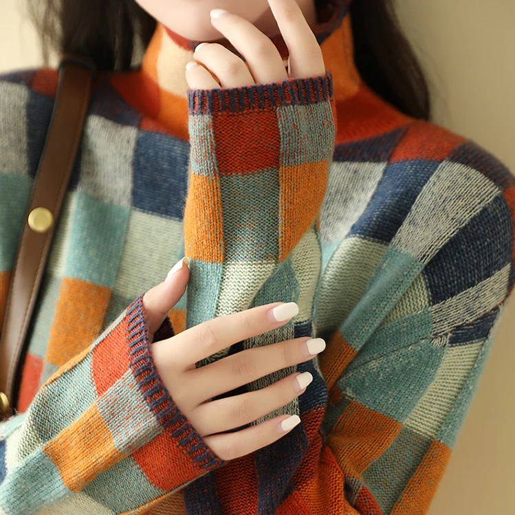 Close-up of a women's color block check knitted sweater, showcasing the cozy texture and stylish design.