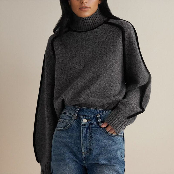 Close-up of a soft knitted color block turtleneck sweater for women, a winter fashion essential.